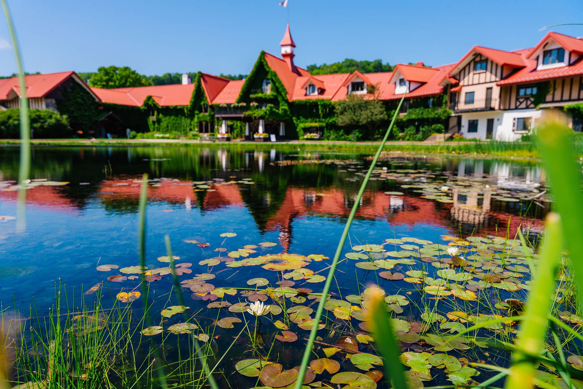 The Highlands front pond with the Main Lodge in the background
