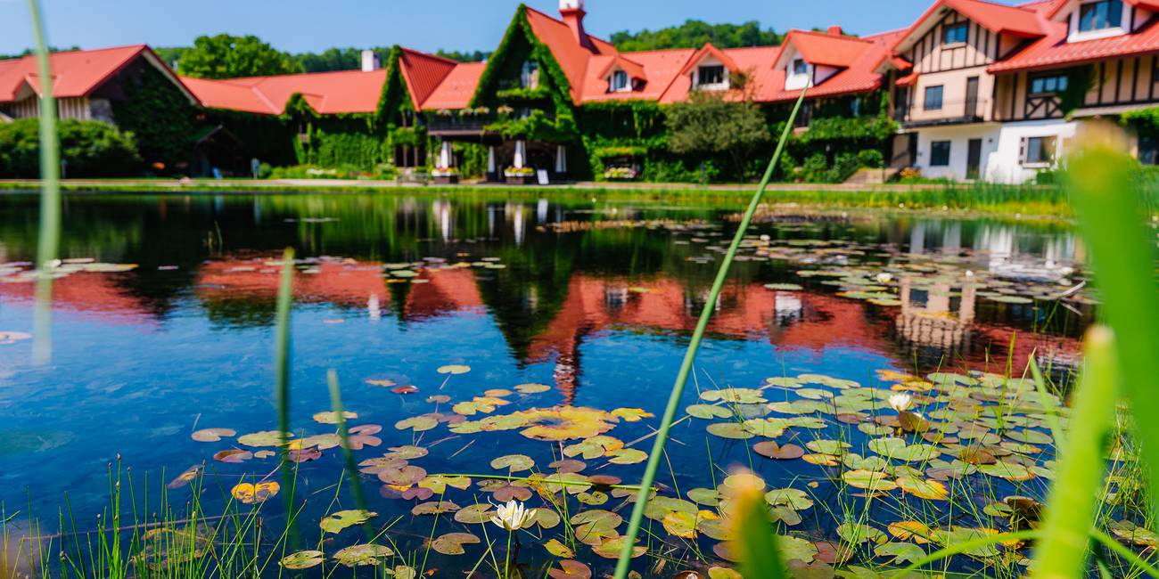 The Highlands front pond with the Main Lodge in the background
