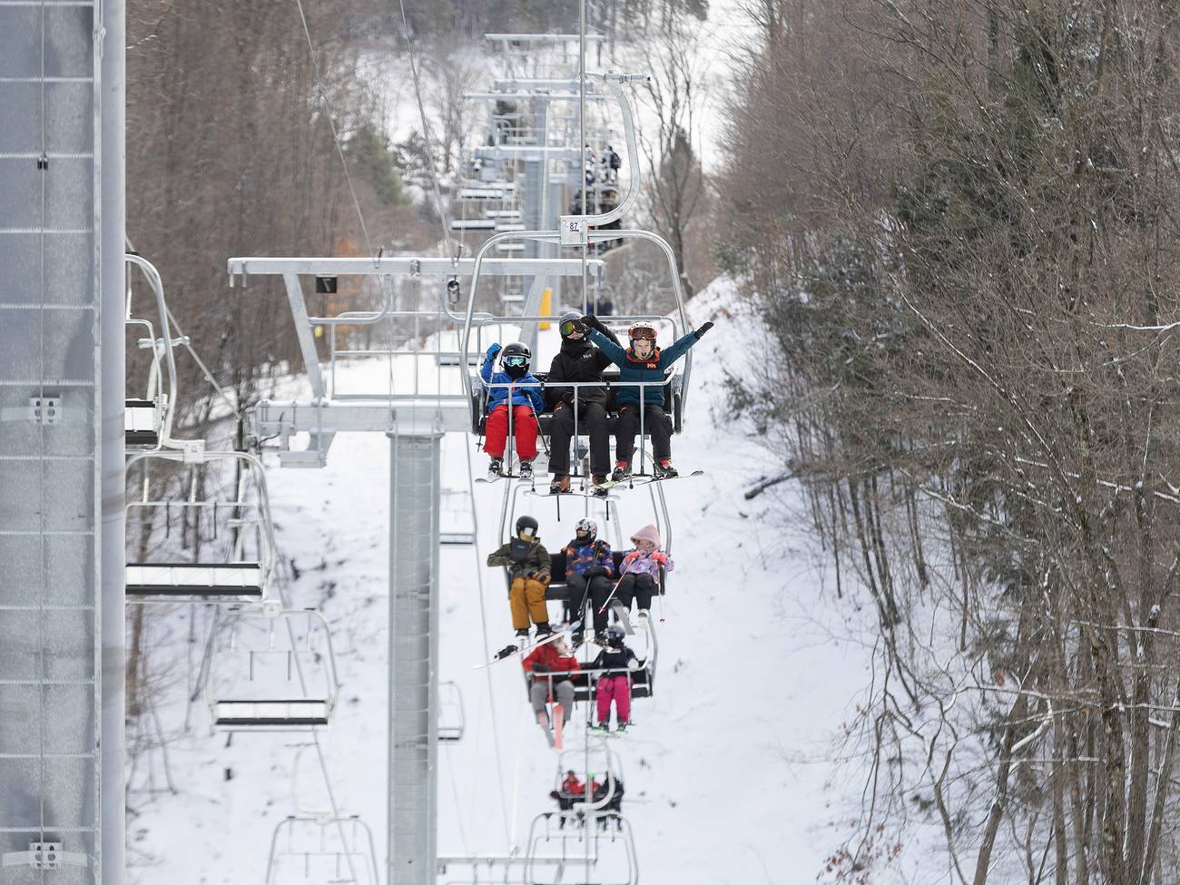 People on the Interconnect Chairlift at The Highlands