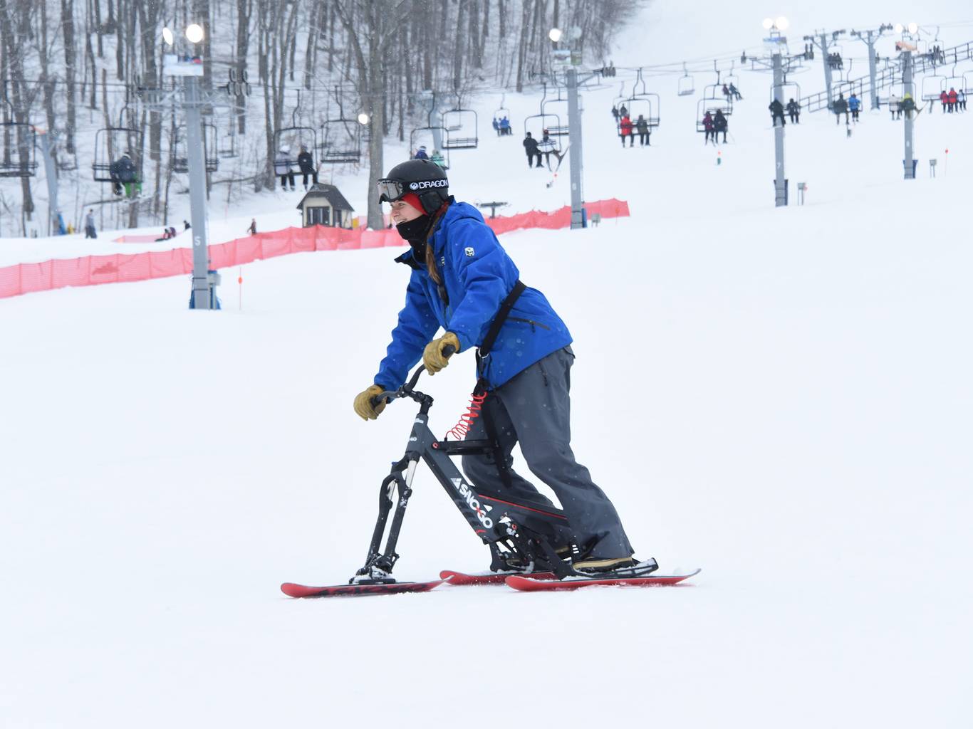 A woman on a Sno-Go Bike at The Highlands