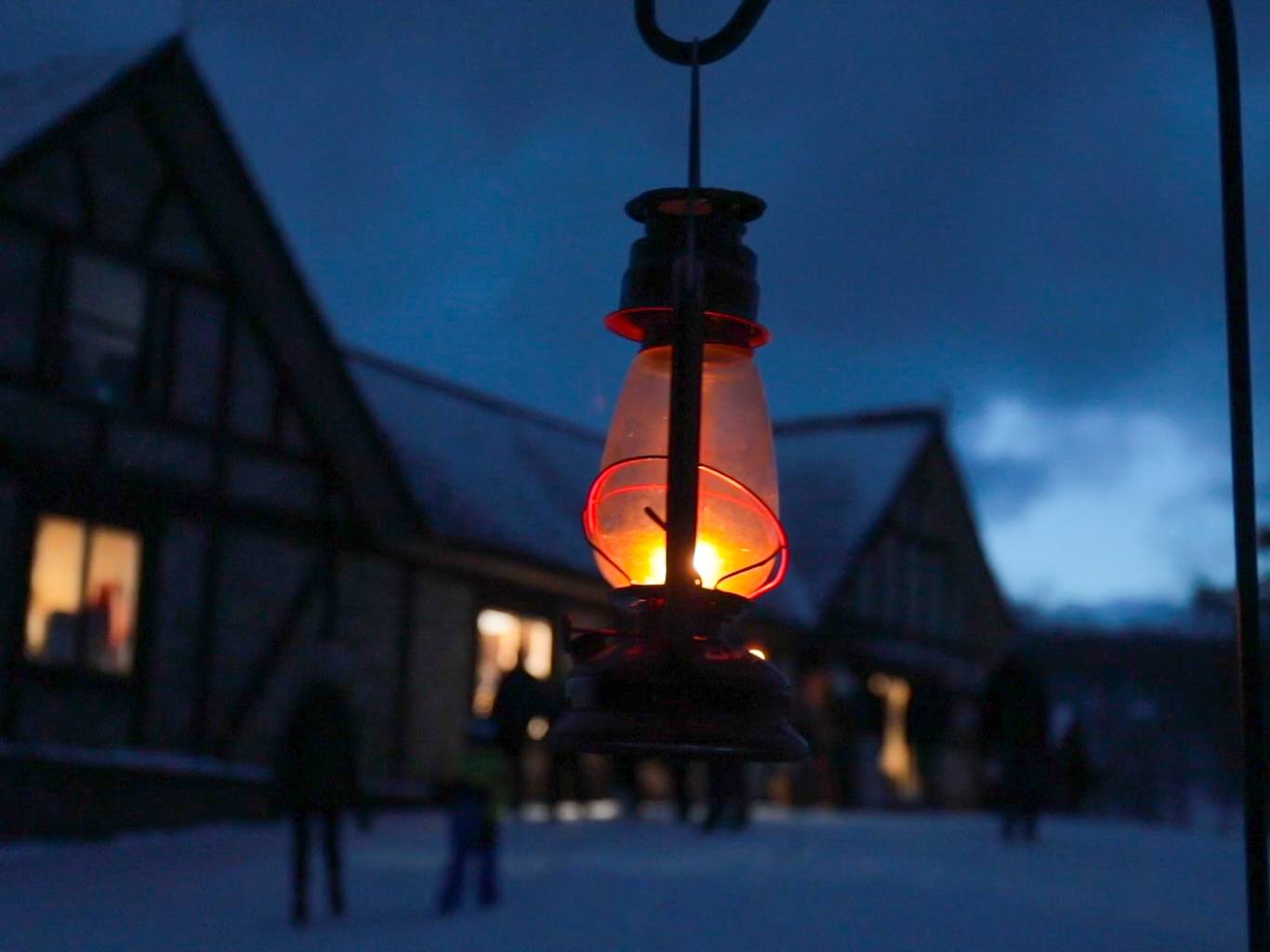 A closeup of a lantern lit up at night