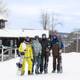A group of skiers posing at North Peak at The Highlands