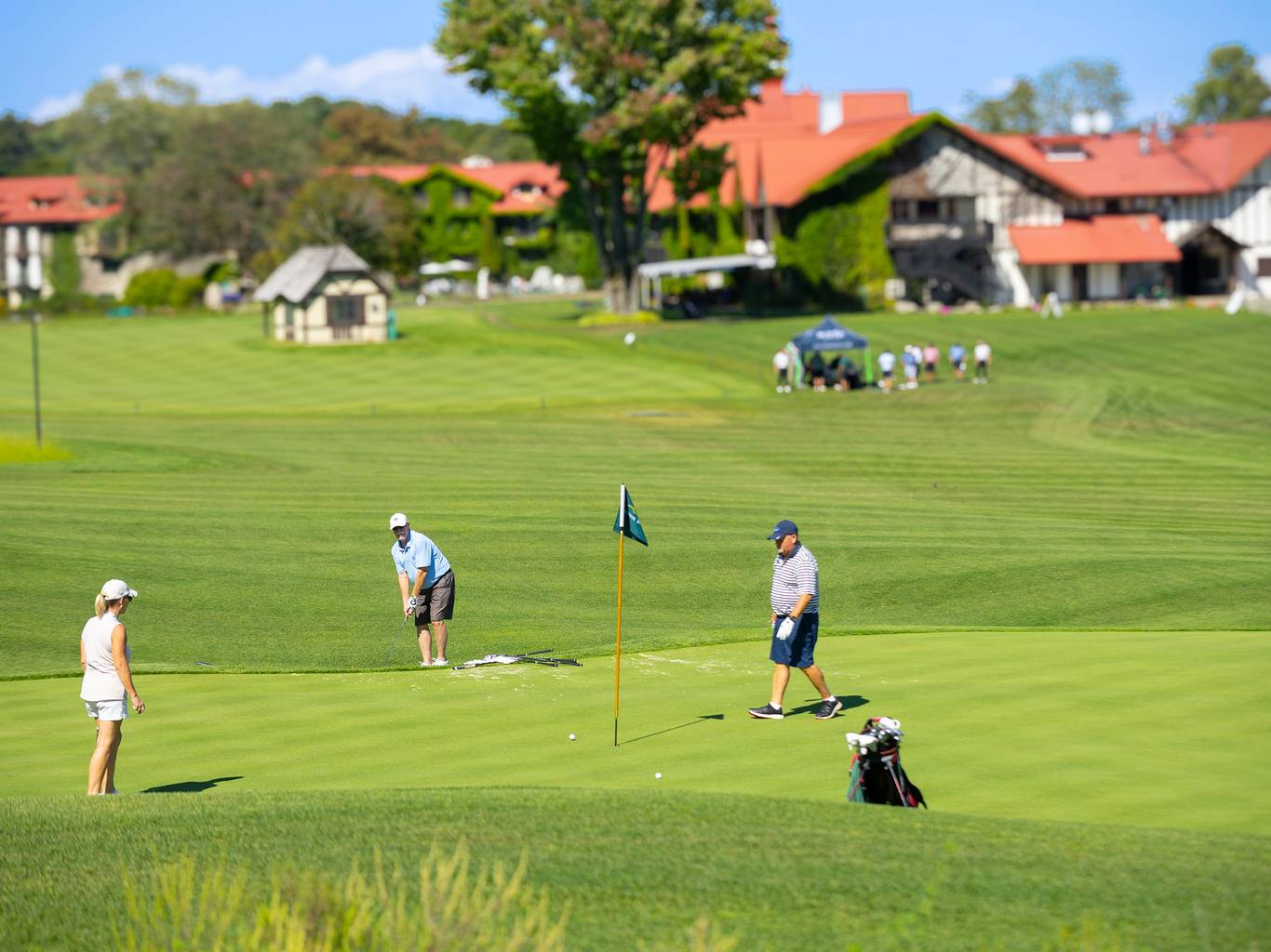 A group of golfers playing on Doon Brae at The Highlands